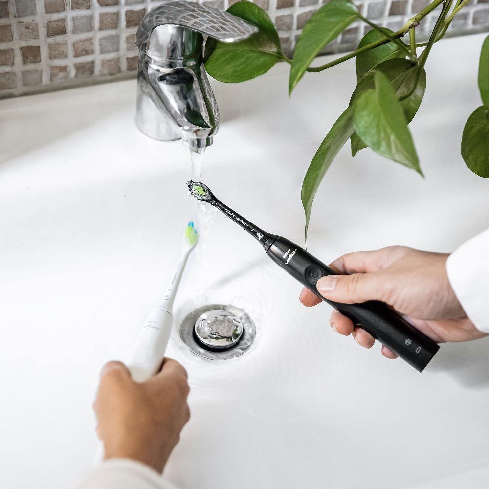QVC Philips Spazzolino elettrico Serie 4100 + 5 testine di ricambio Liquidazione